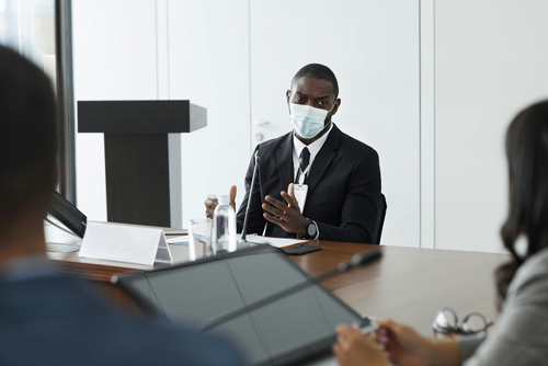 Business meeting discussing healthcare policies